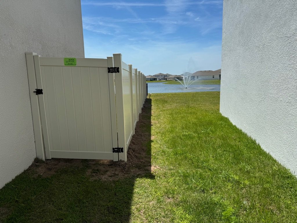 North River Fence Completes Premier Residential Installation of 76 Feet of 6-Foot High Tan PVC Privacy Fence and 68 Feet of 4-Foot High Black Aluminum 3-Rail Fence in Bella Lago Community